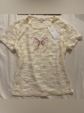 NWT Ultra Flirt Cream Lace Short Sleeve Top with Pink Bow Accent